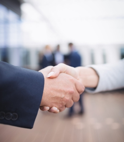 Close-up of businesspeople shaking hands